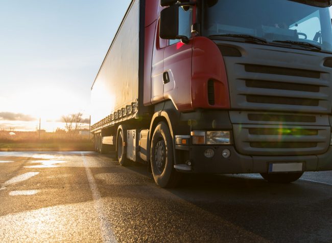 close up of truck on parking transportation, freight transport and vehicle concept - close up of truck on parking